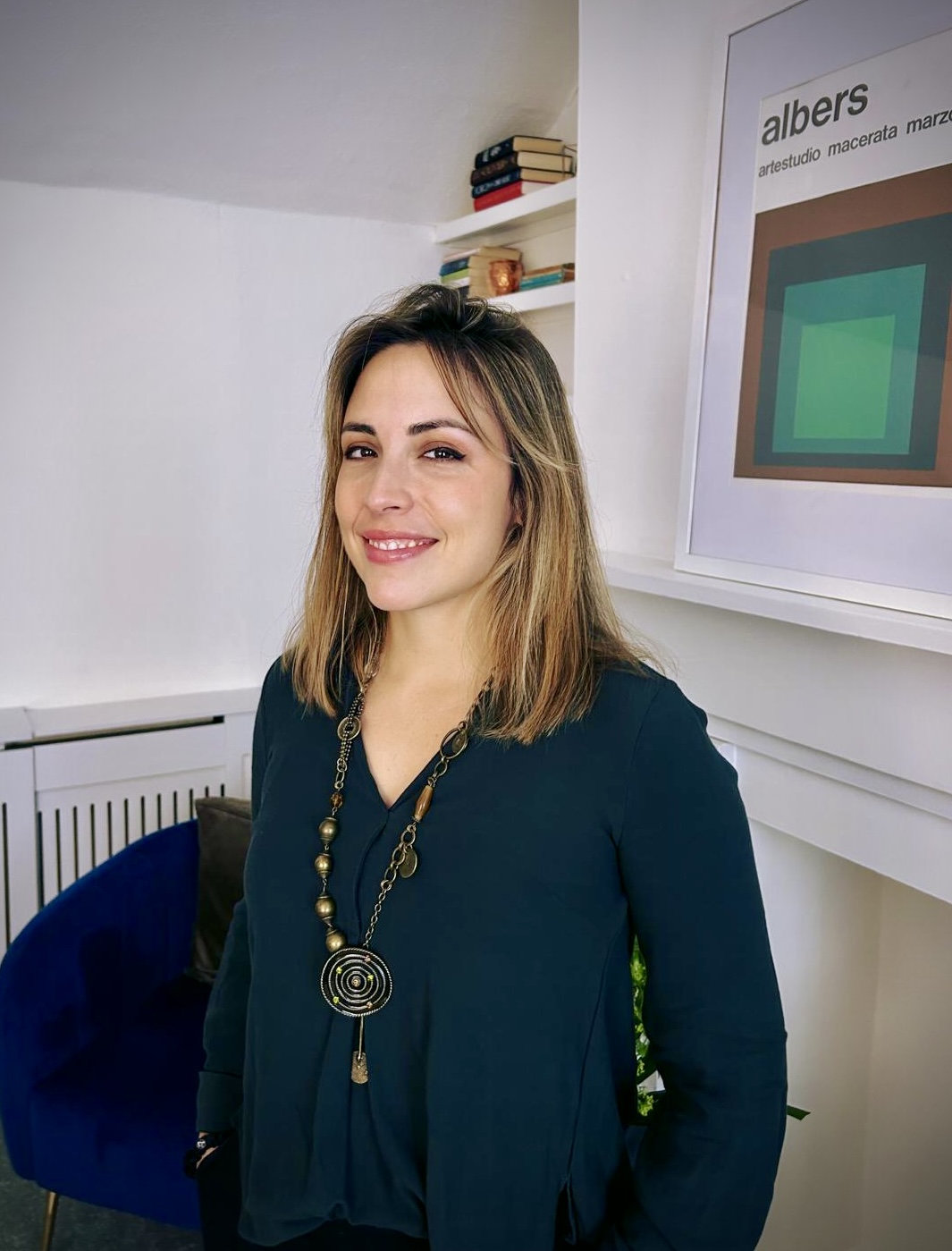 Caroline Silvestre standing in her consulting room